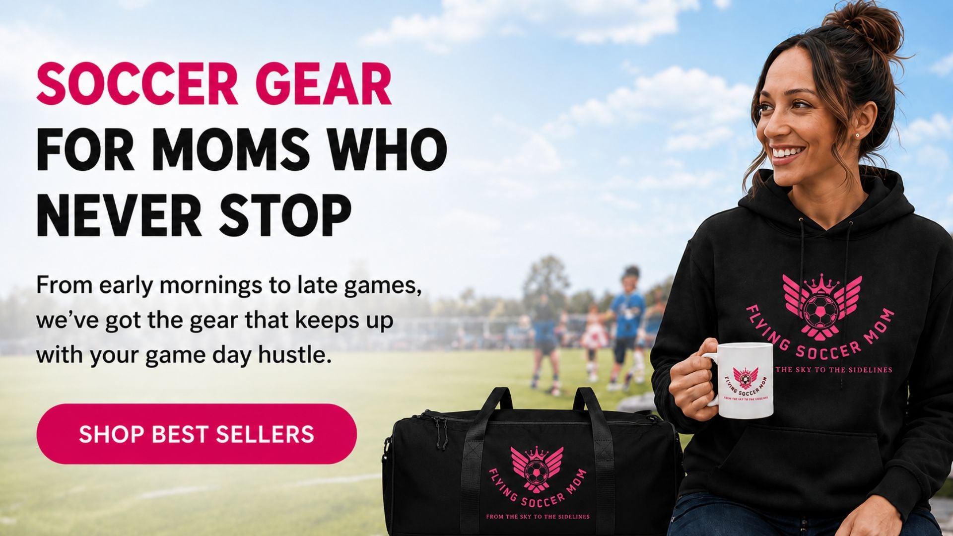 A woman in a black hoodie with a pink 'Flying Soccer Mom' logo holds a white mug with the same logo while standing outdoors on a soccer field. A black duffel bag with the same logo is in the foreground.