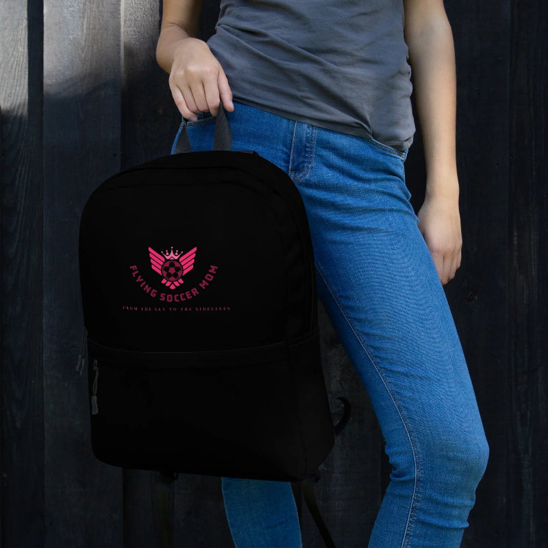 Flying Soccer Mom Backpack Black held by the strap