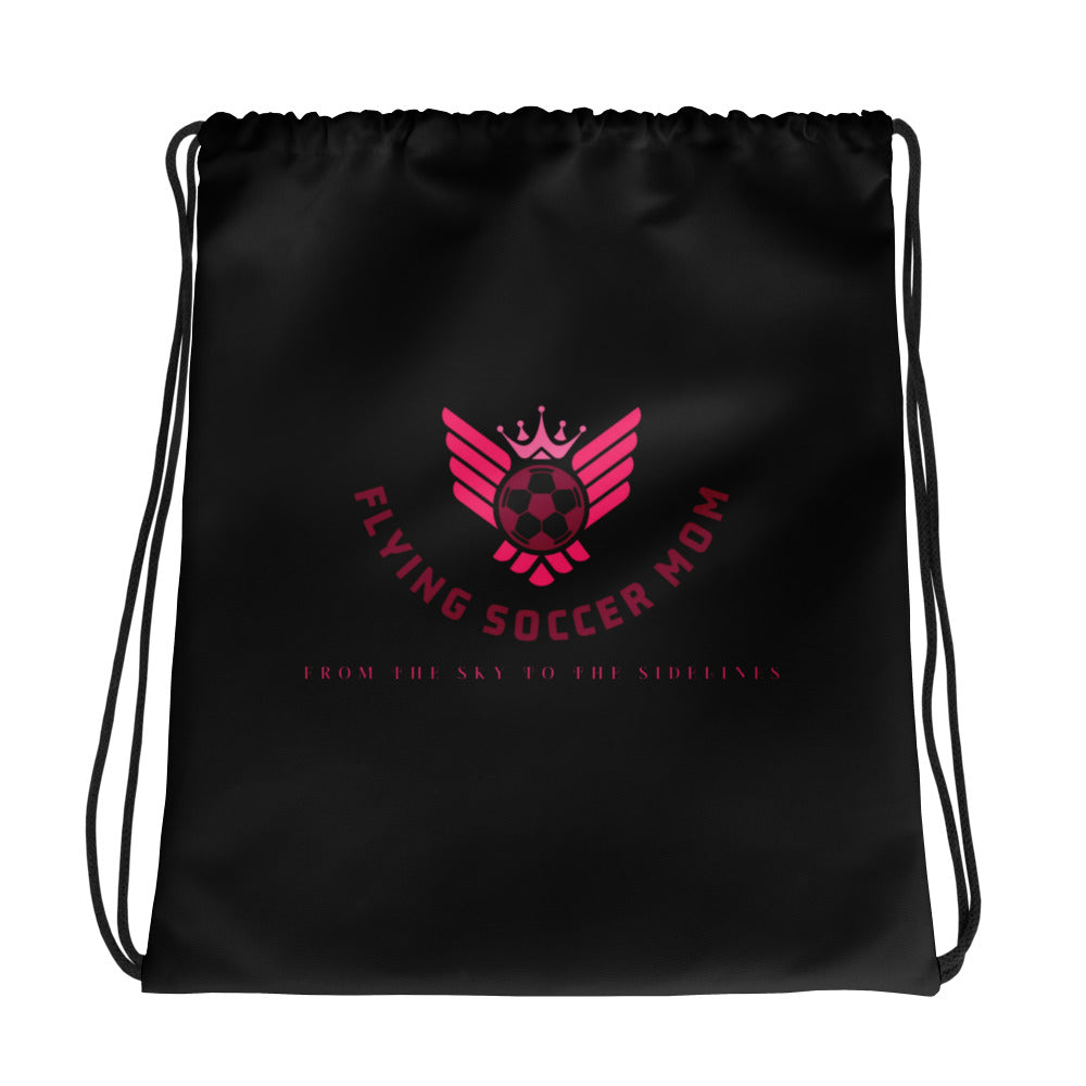 Flying Soccer Mom Drawstring Bag Black on the soccer field