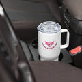 Soccer mom stainless steel tumbler with handle resting in a car cup holder, designed for busy lifestyles.