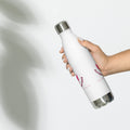 White soccer mom water bottle held in hand showing back design